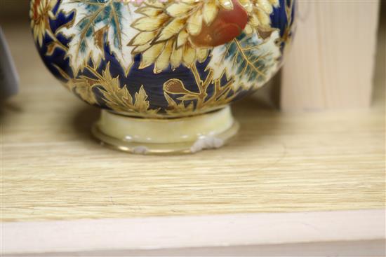 A pair of Zsolnay Pecs reticulated vases, floral-decorated on a blue ground and heightened in gilt height 20cm (a.f.)